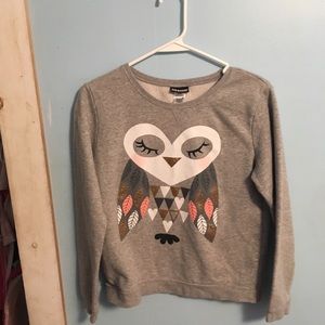This is a gray sweatshirt with an owl on it